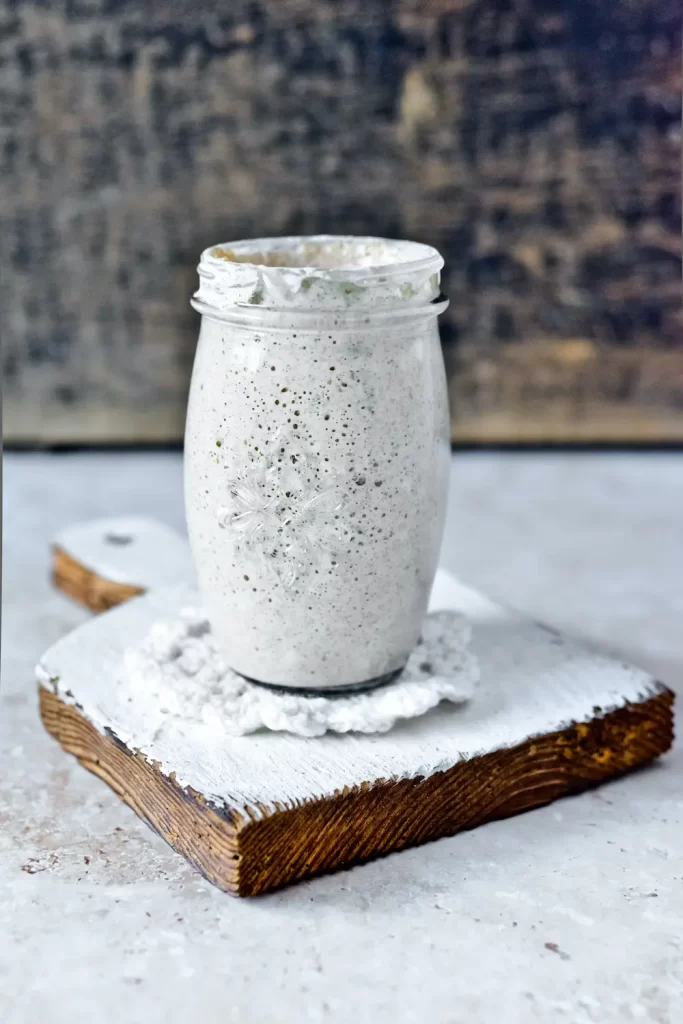 Sourdough starter in jar on counter