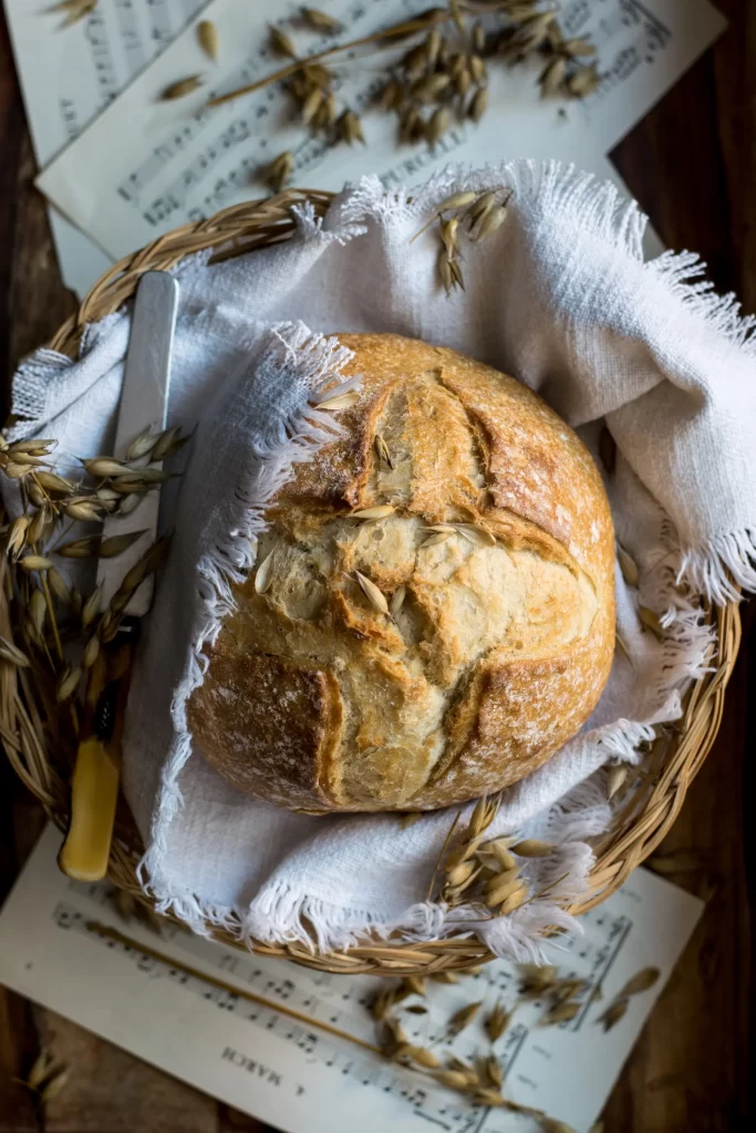 Freshly baked sourdough loaf in basket