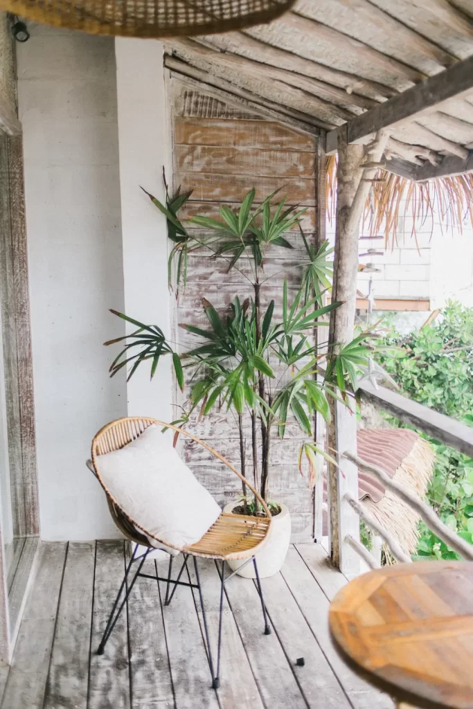 apartment patio chair and table with plant in background