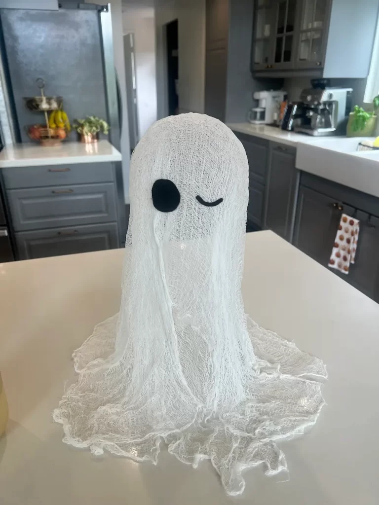 DIY cheesecloth ghost on counter in home