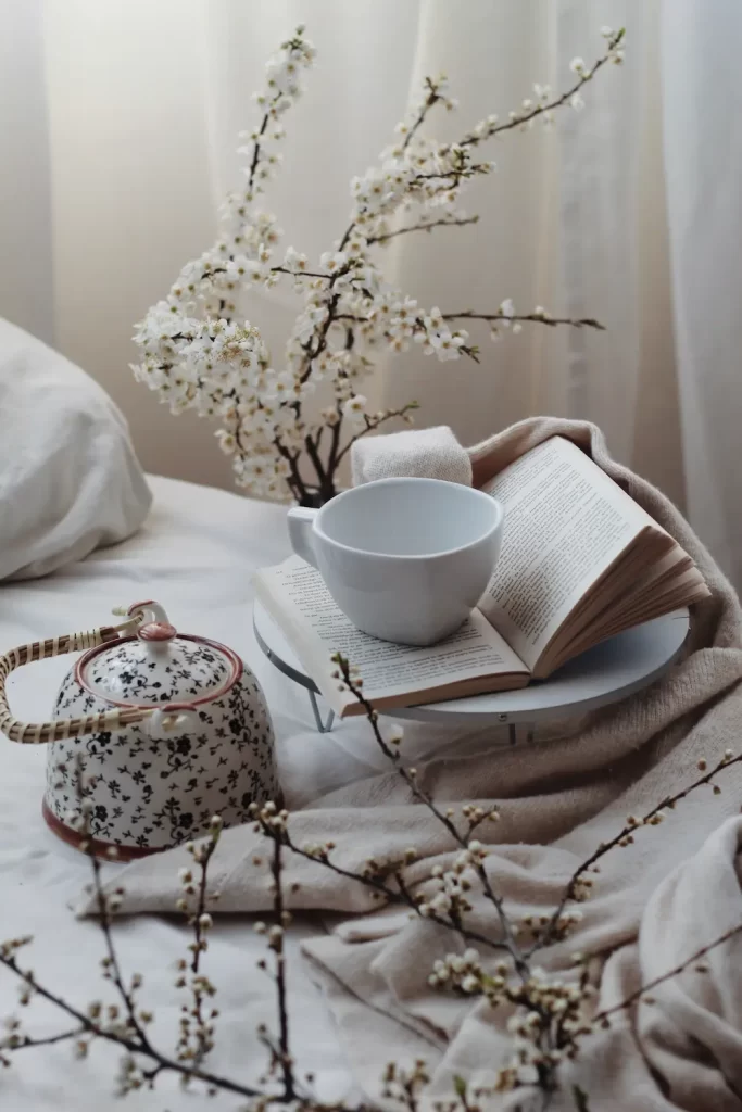 tea pot and cup on bed in apartment