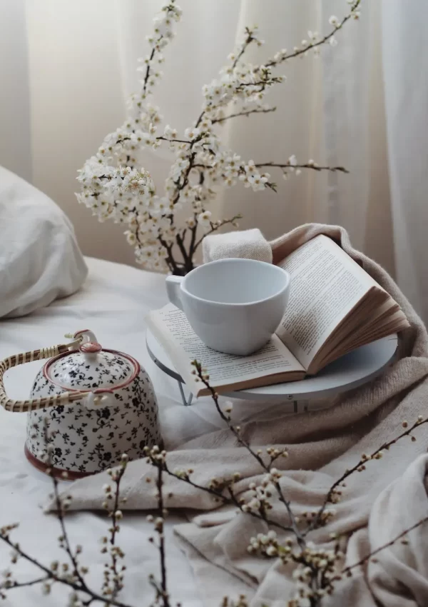grandmacore home decor -- florals with a teacup and teapot on table