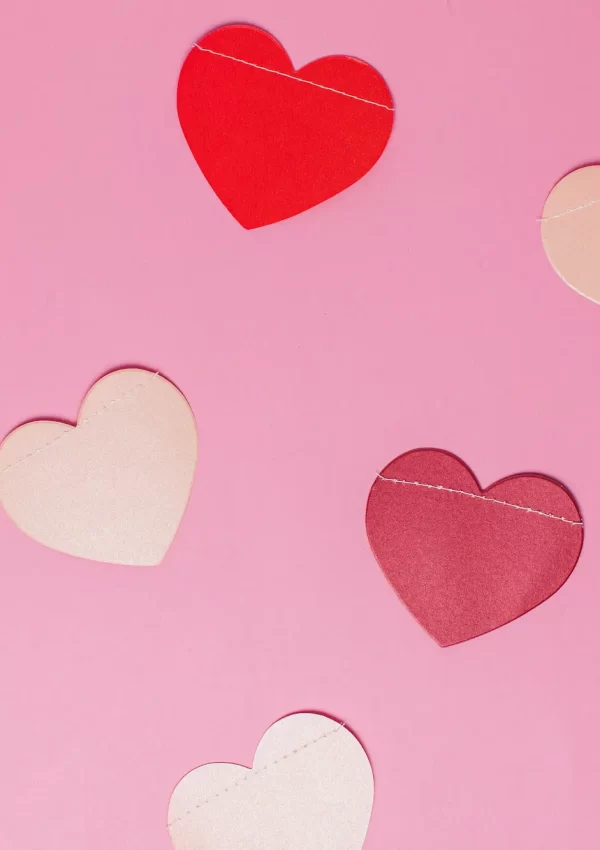 paper hearts on a pink background